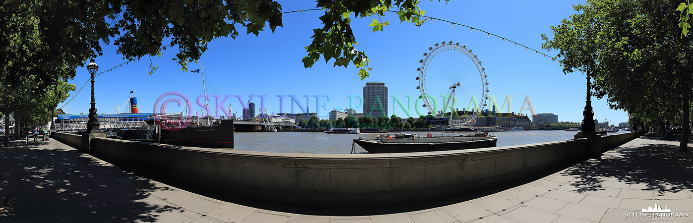 Bilder aus London - Die Uferpromenade der Themse im Stadtteil Westminster mit Blick auf das bekannte Riesenrad London Eye. 