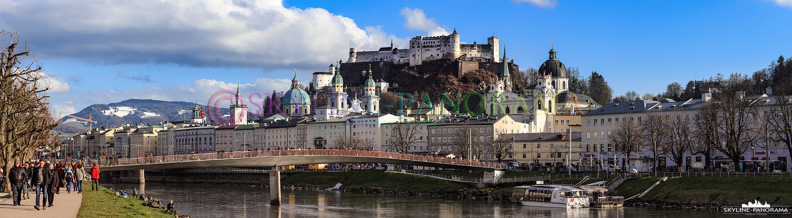 Salzburg am Tag - Panorama vom Elisabethkai am Ufer der Salzach in Richtung der Altstadt von Salzburg und der über alles thronenden Festung Hohensalzburg.